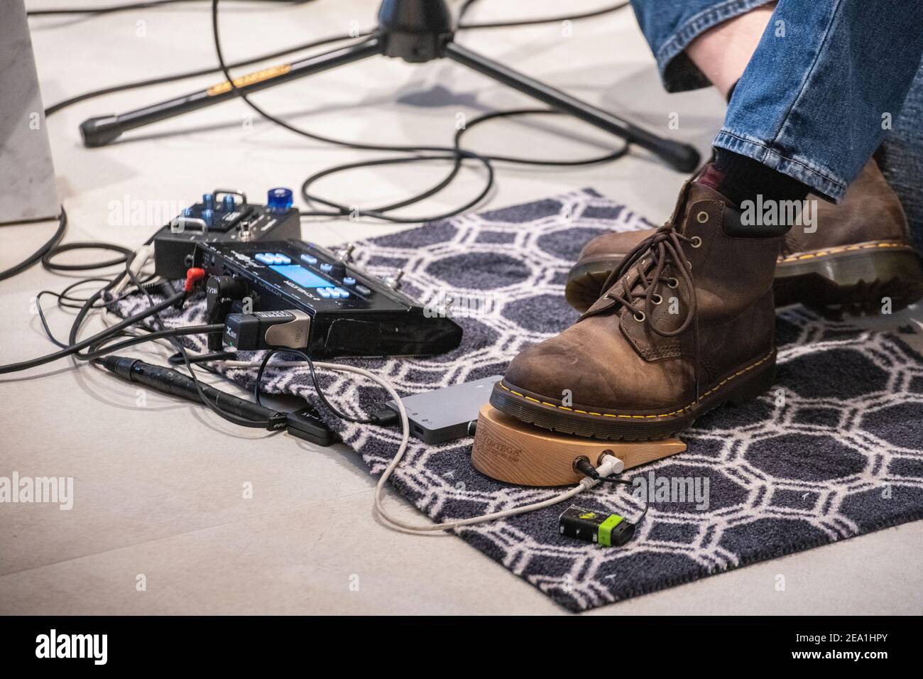 A guitarists feet and pedals at a concert Stock Photo Alamy