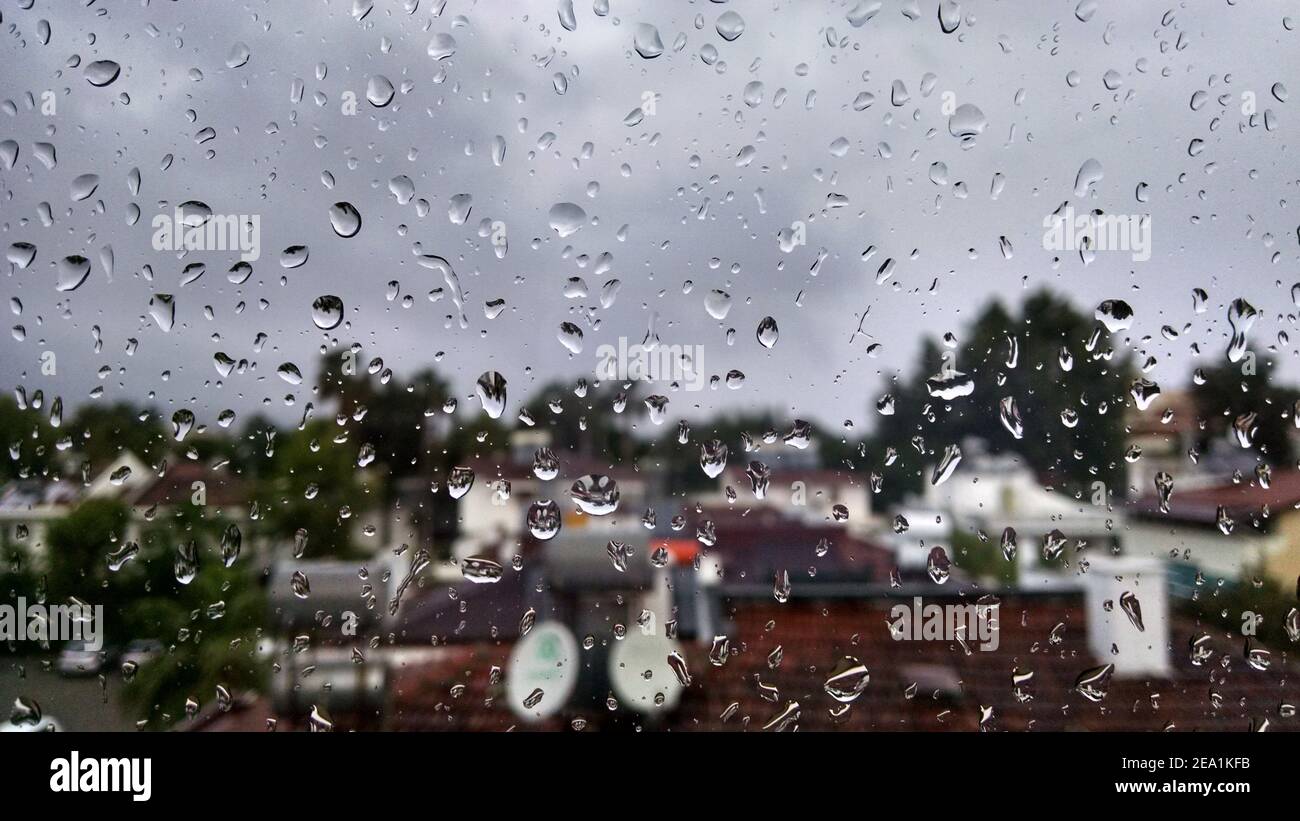 Background of rain drops on window close up. Flat lay. Stock Photo