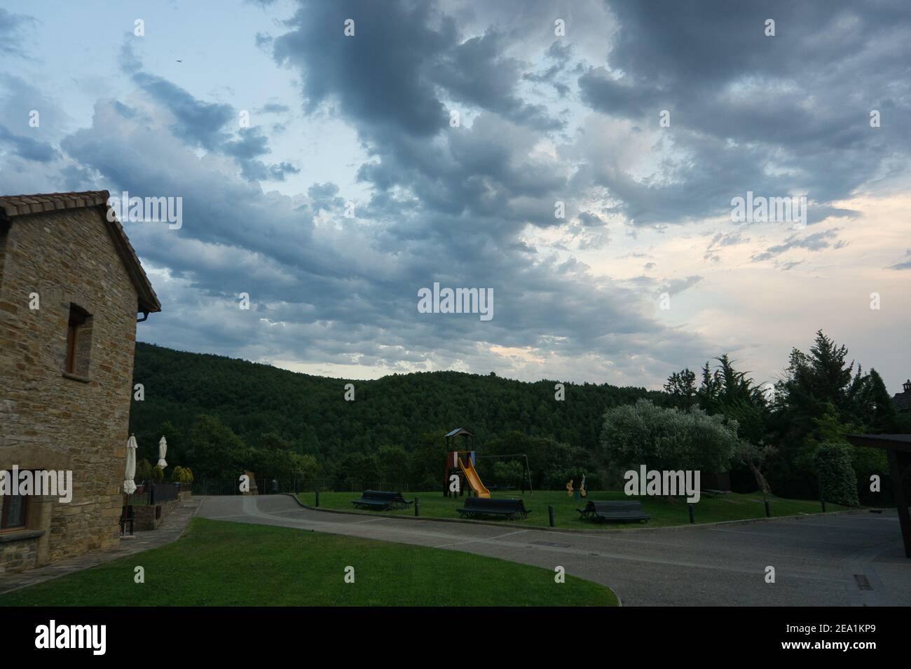 beautiful-sunset-in-a-rural-house-with-mountains-behind-in-the