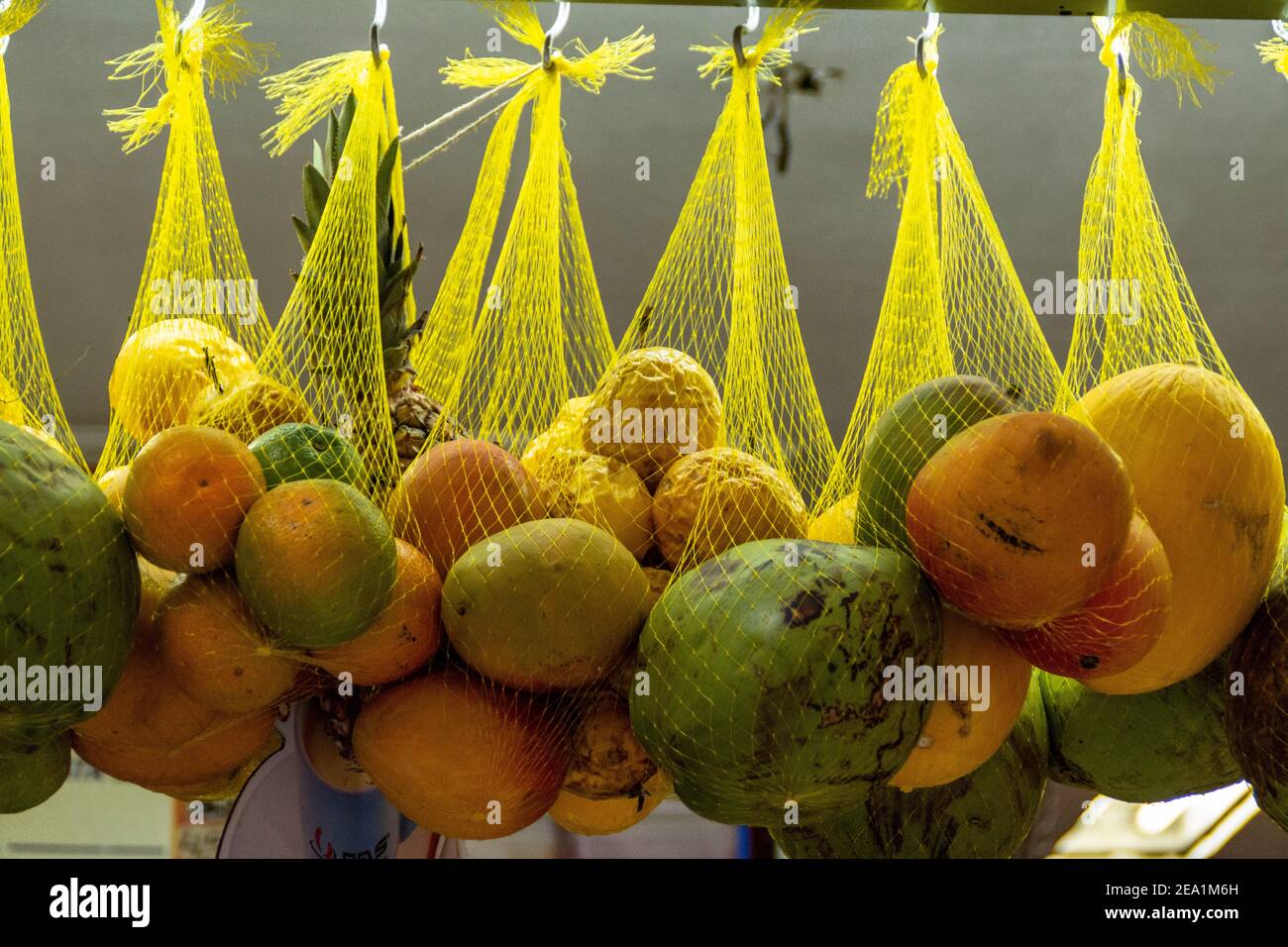 Hanging baskets of a mix of Brazilian fruits for making fresh fruit juices at one of the many soft drink bars in Sao Paulo, Brazil Stock Photo