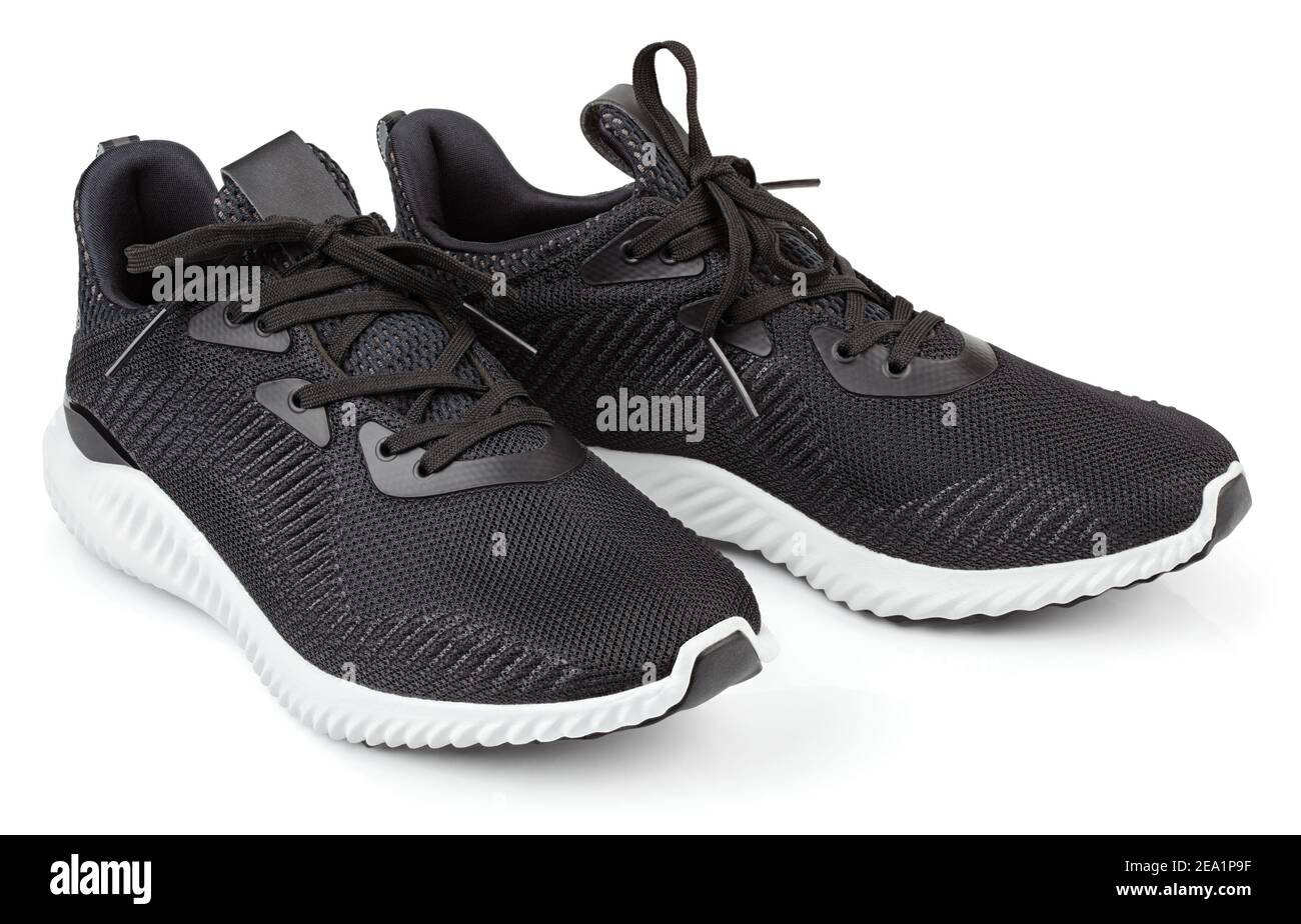 Pair of new unbranded black sport running shoes, sneakers or trainers isolated on white background with clipping path Stock Photo