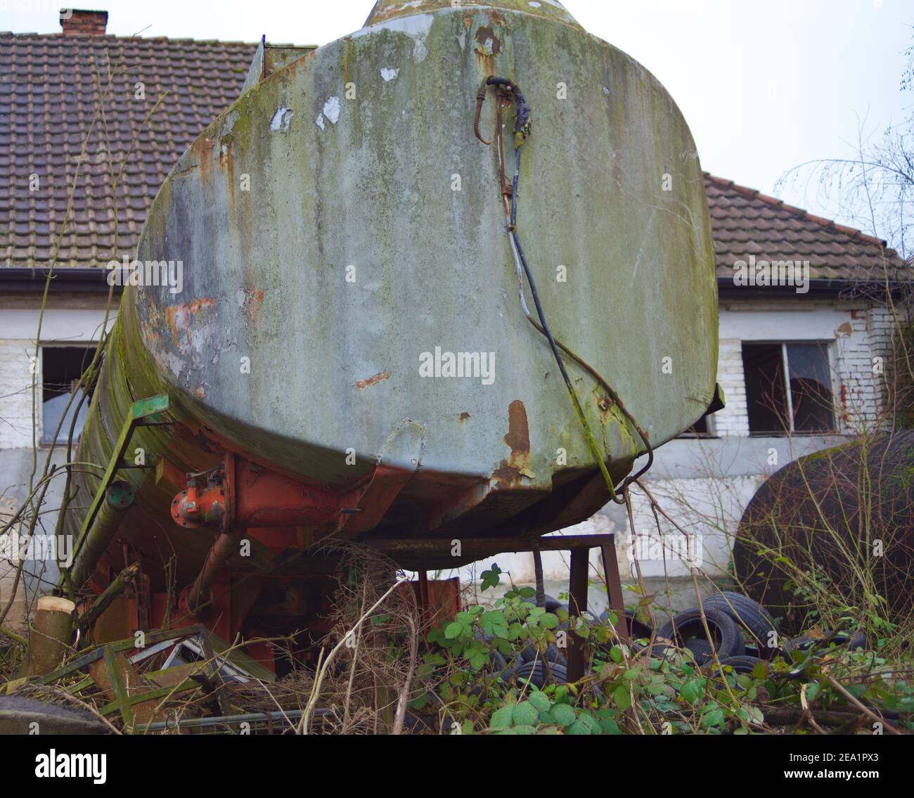 old road tanker in an abandoned factory Stock Photo