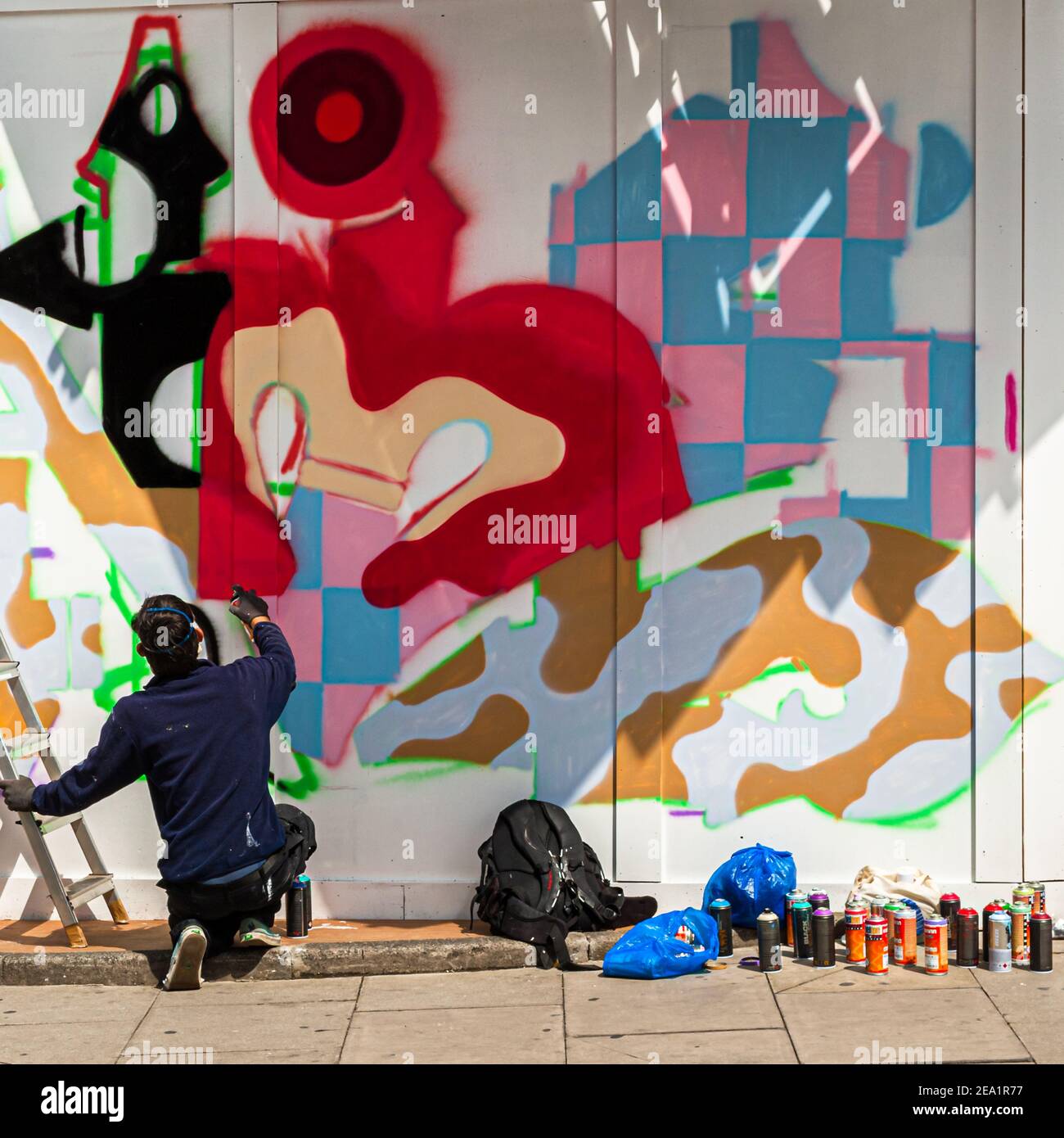A sprayer sprays street art in London Stock Photo Alamy