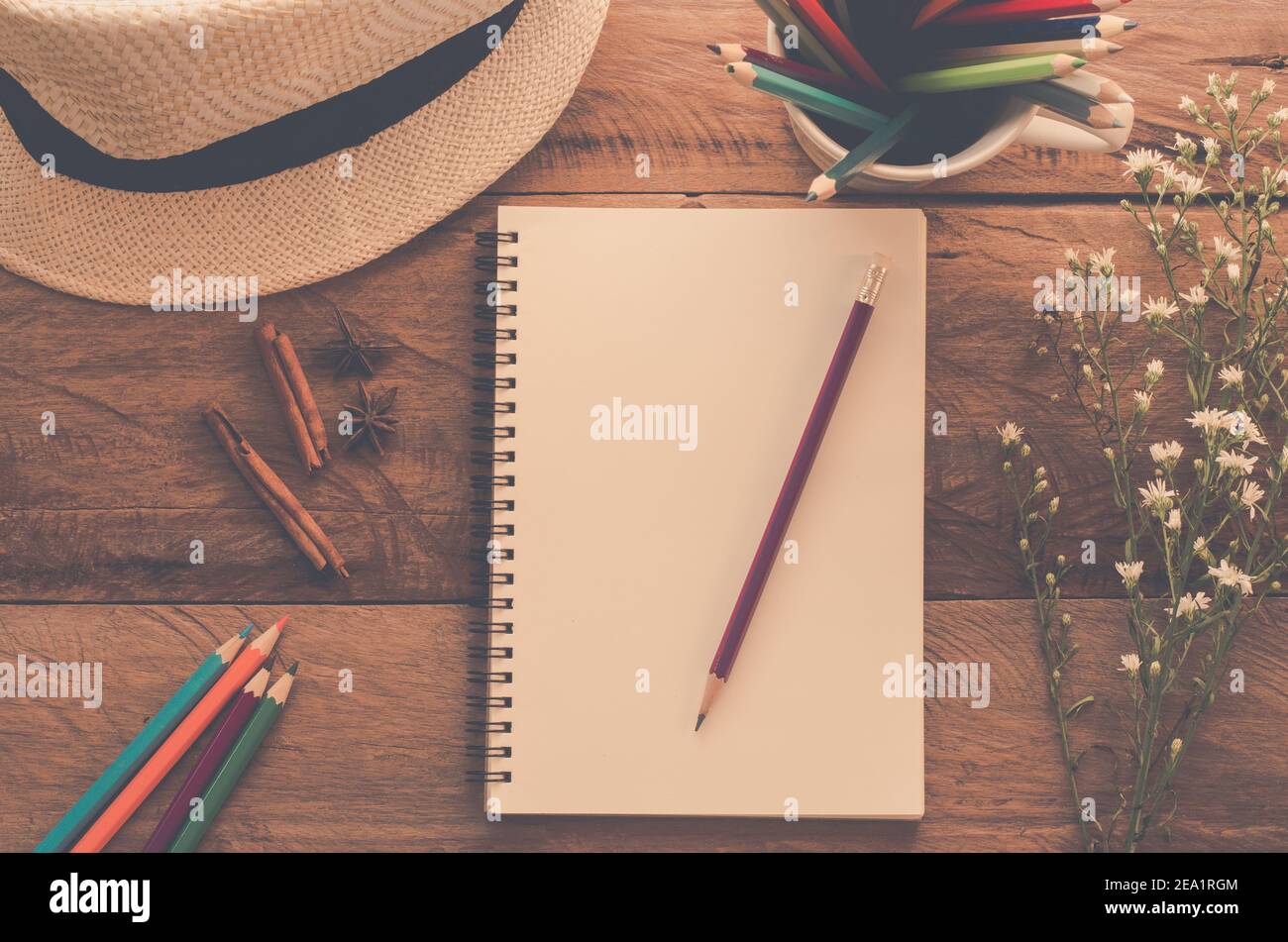 notebook pencil color pencil on wood table - tone vintage Stock Photo ...