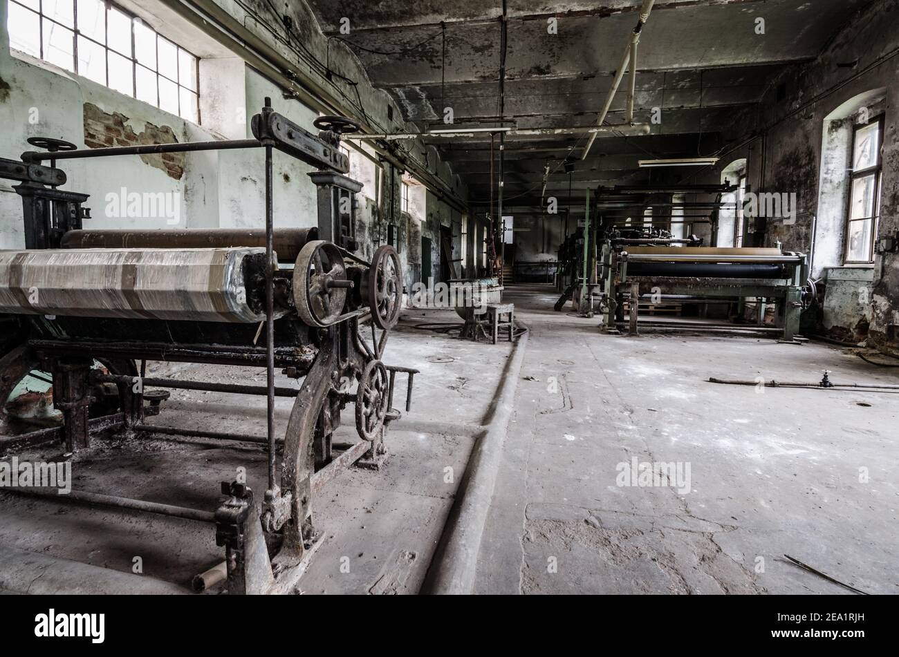 large machine hall in abandoned spinning Stock Photo