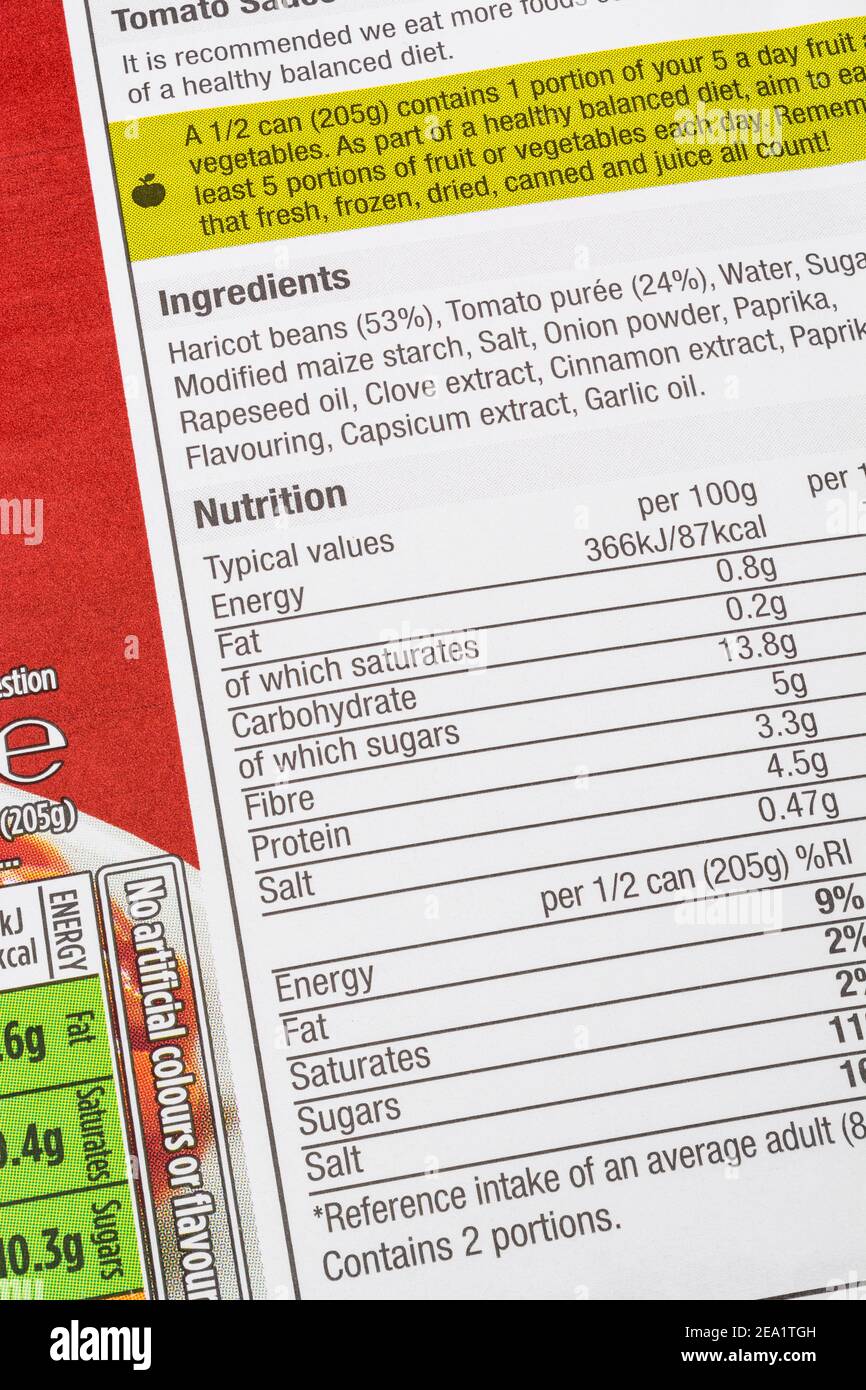 Labelling on Morrison's own-label tinned baked beans. For food ingredients labels, nutrition labelling, food facts, allergy advice, food packaging. Stock Photo