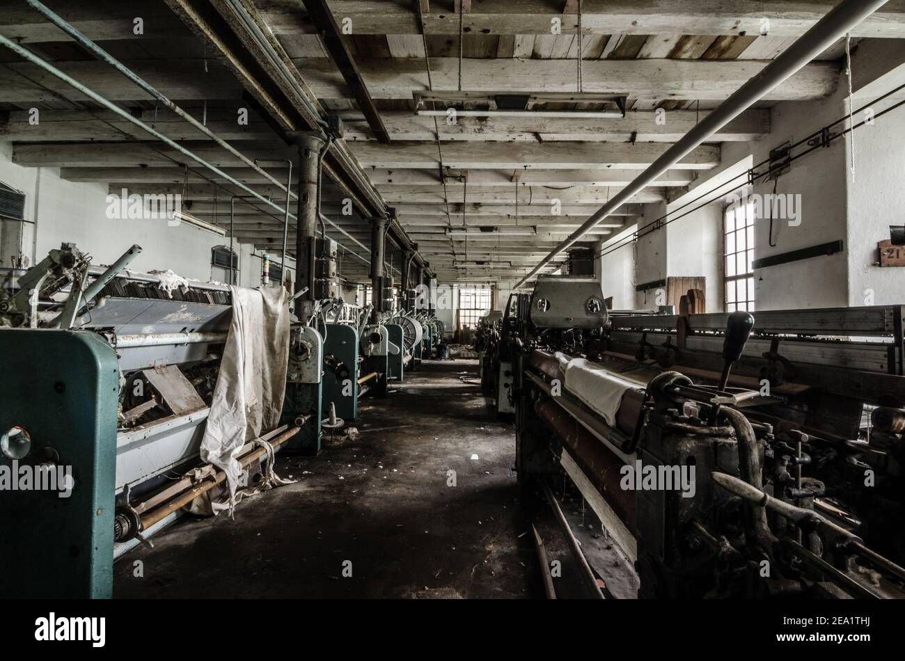 large machine hall in abandoned factory Stock Photo