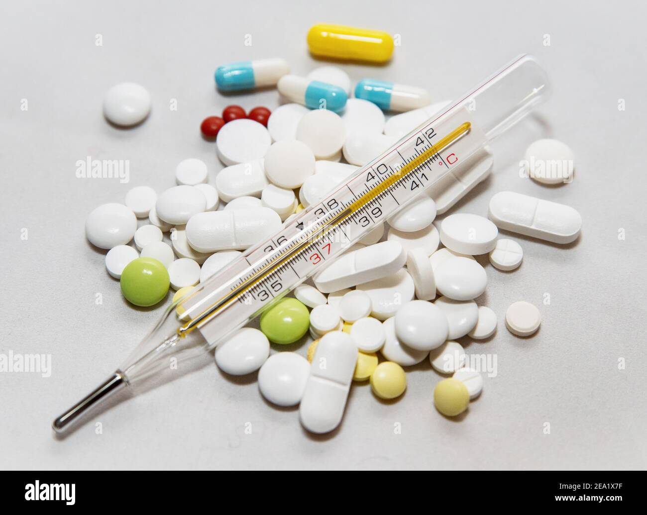Bunch of drugs and thermometer. Stock Photo