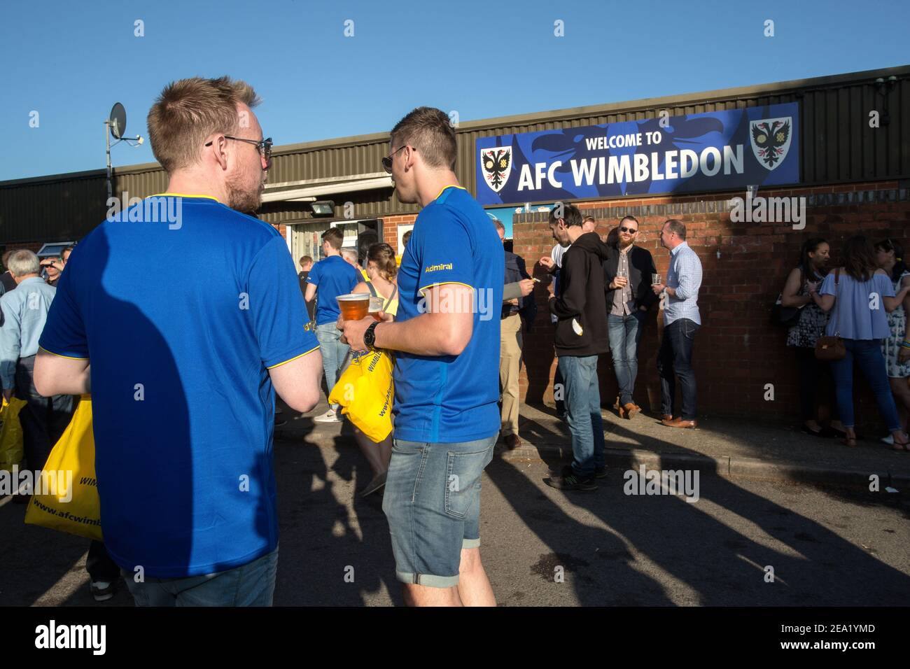 AFC Wimbledon fans drinking beer before the game at AFC Wimbledon football club, England. Stock Photo