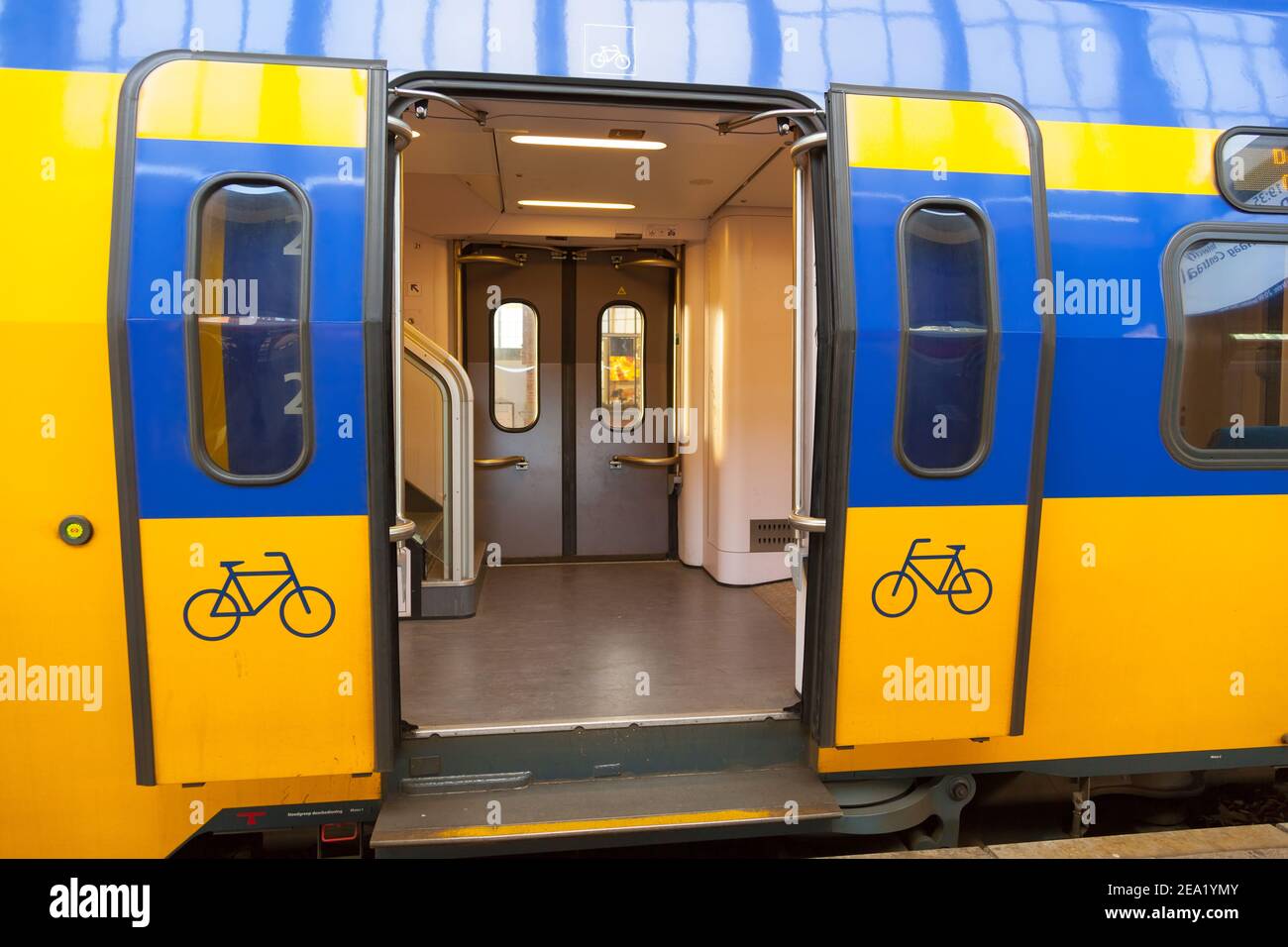AMSTERDAM, TH NETHELANDS OCTOBER 07, 2012 Yellowblue wagon of traditiona trains in Holland