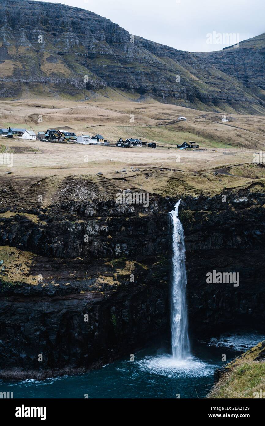 Gasadalur, Faroe Islands - December 21, 2018. The Mulafossur Waterfall at Gasadalur in the Faroe Islands. Stock Photo