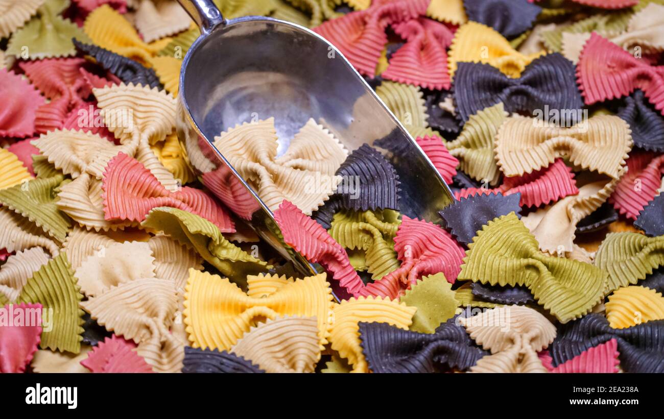 Colored Farfalle Pasta bow tie pasta background Stock Photo - Alamy