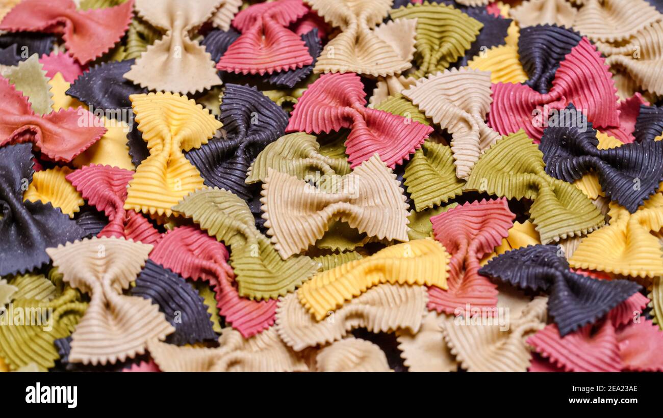 Colored Farfalle Pasta bow tie pasta background Stock Photo - Alamy