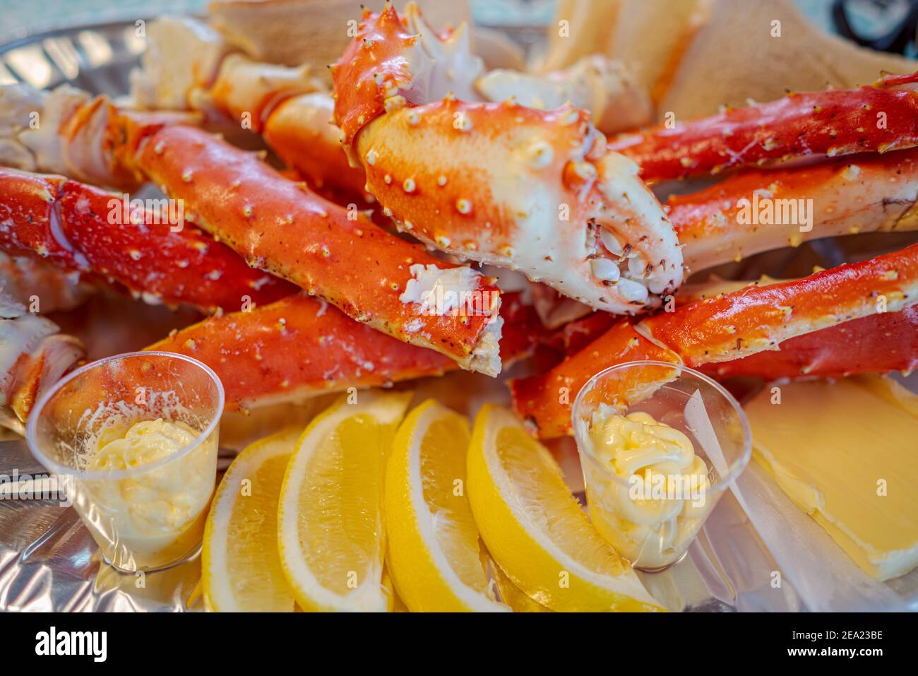 Red king crab legs with fresh lemon slices. Delicious seafood and