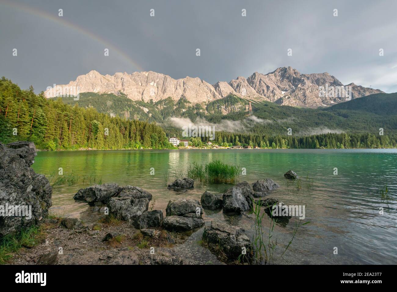 Rocks on the shore, Eibsee lake in front of Zugspitze massif with ...