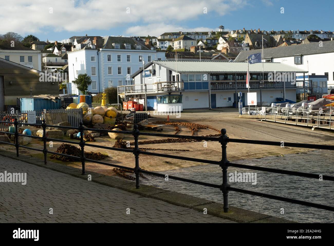 Falmouth Watersports Bar &Cafe across an expanse of slipway with chain, buoys and anchors. Closed due to Covid 19 pandemic lockdown. No people around. Stock Photo