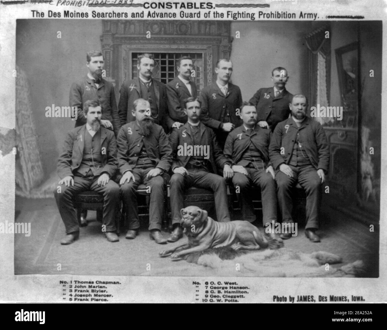 Constables the Des Moines Searchers and Advance Guard of the Fighting Prohibition Army.  Photograph shows group portrait of constables: Thomas Chapman, John Marian, Frank Blyler, Joseph Mercer, Frank Pierce, O.C. West, George Hanson, G.B. Hamilton, George Cleggett and G.W. Potts, posed with bloodhound, circa 1889 Stock Photo