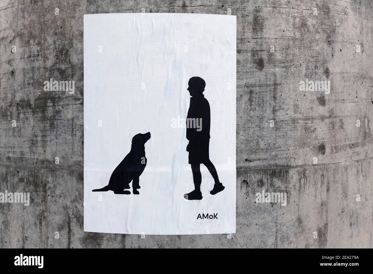 Paste-up, dog and man, silhouette by streetart artist Amok, Duesseldorf, North Rhine-Westphalia, Germany Stock Photo