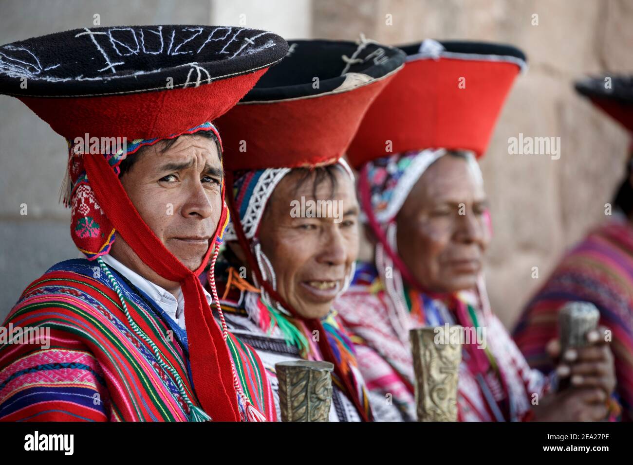Local Quechua mayors (varayocs) dressed in traditional costumes before mass, Pisac Sunday Market, Cusco, Peru Stock Photo