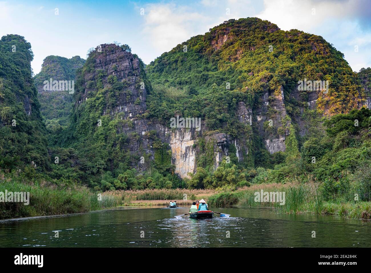 Boating, Limestone mountains, Trang An Scenic Landscape Complex, UNESCO world natural heritage, Vietnam Stock Photo