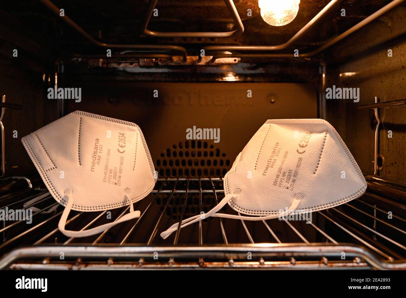 FFP2 masks are reprocessed in the oven at 80C top and bottom heat, disinfected, Corona crisis, Germany Stock Photo