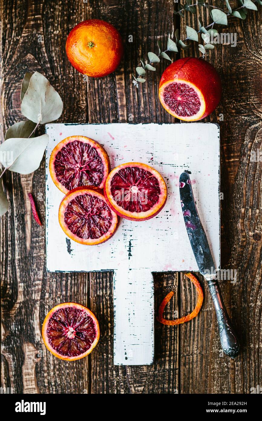 Bloody Sicilian oranges on a wooden background. Top view top view close up, copy space Stock Photo