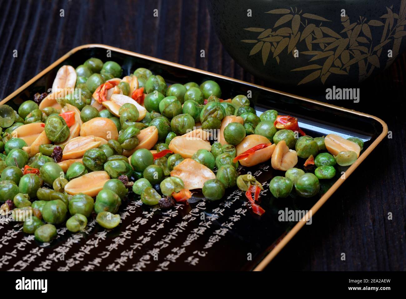 Asian snacks in shell, peanuts, green peas, chili Stock Photo - Alamy