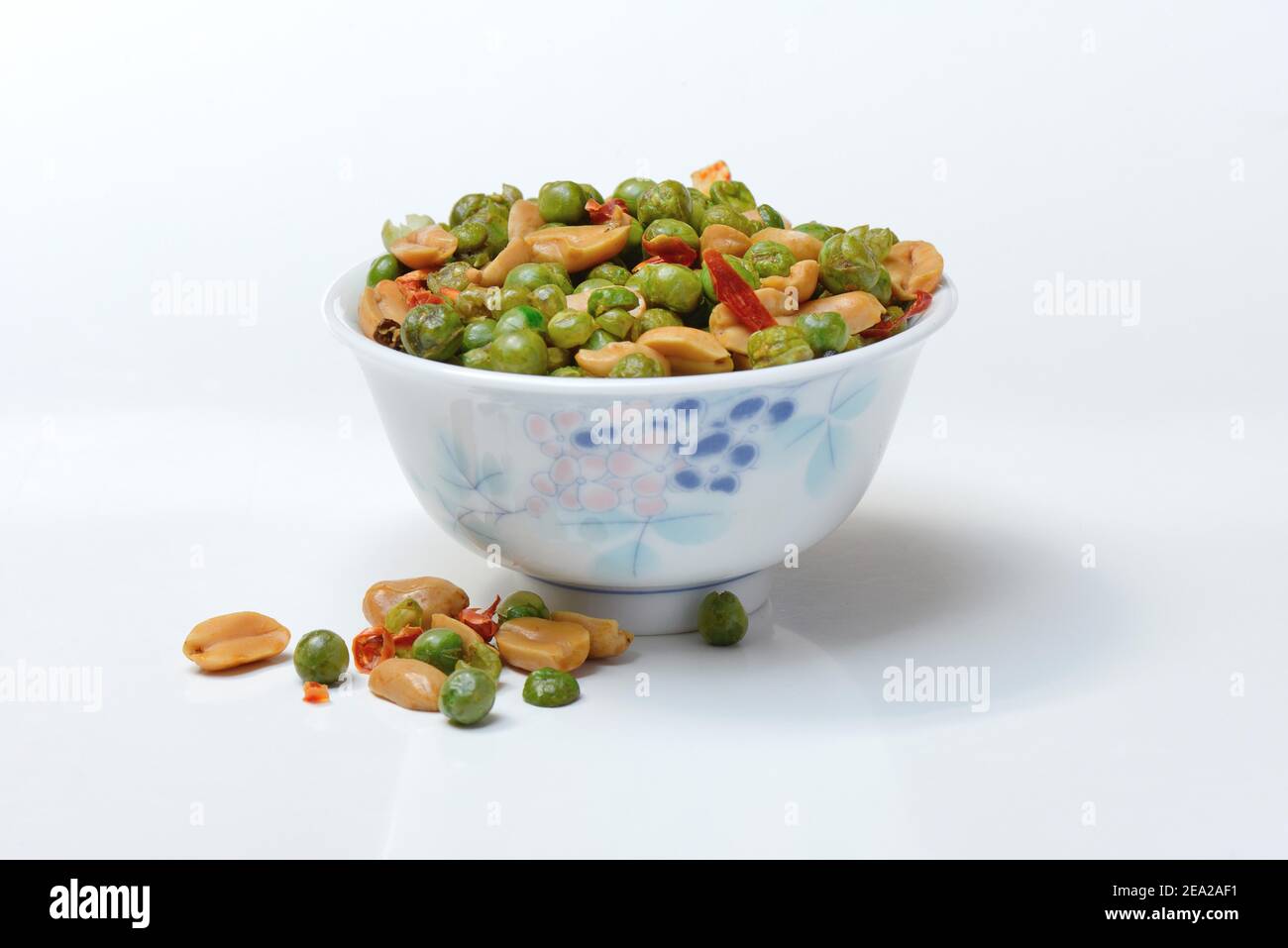 Asian snacks in shell, peanuts, green peas, chili Stock Photo - Alamy