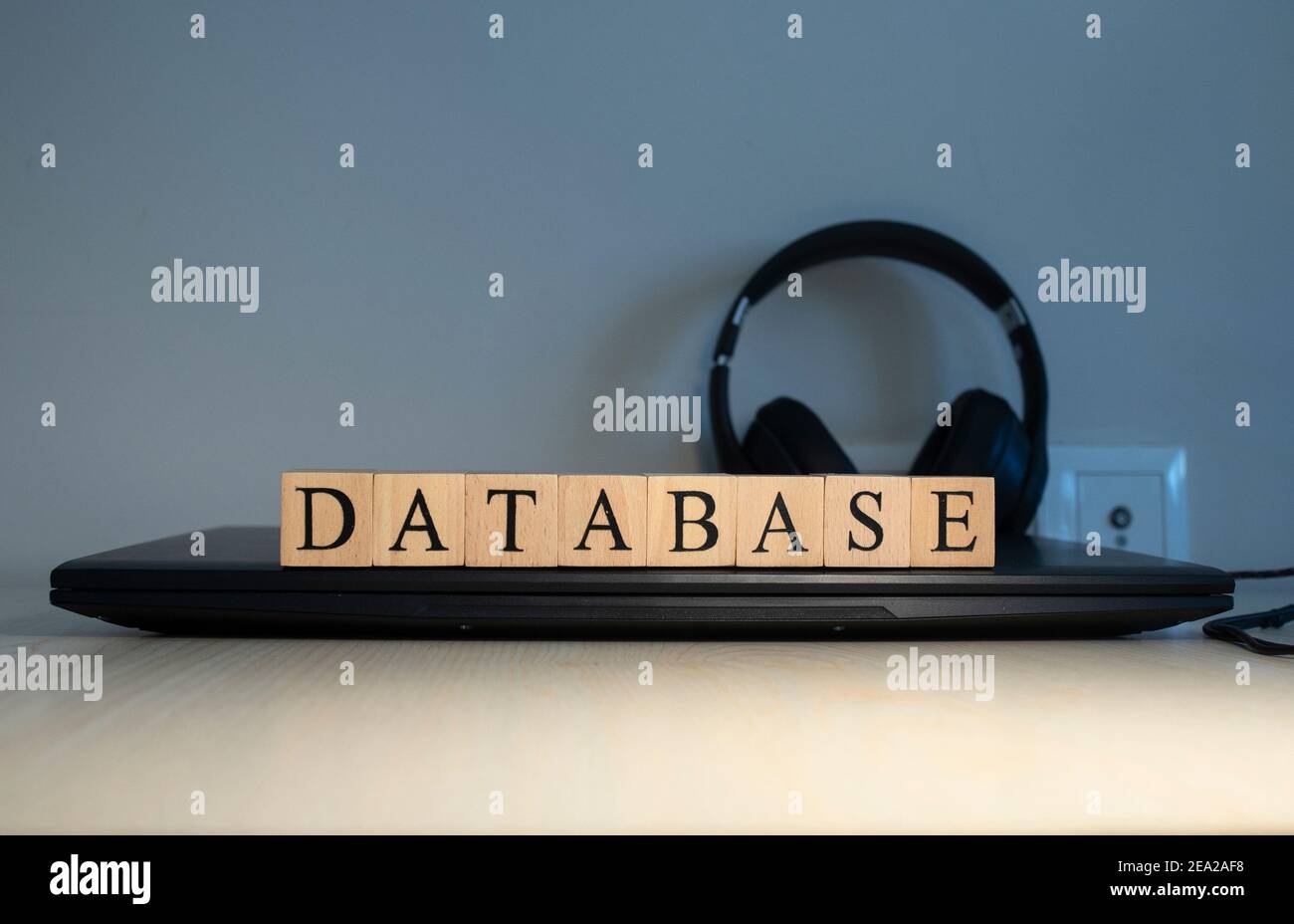 DATABASE message word on a wooden desk on cube blocks. Close up Stock Photo