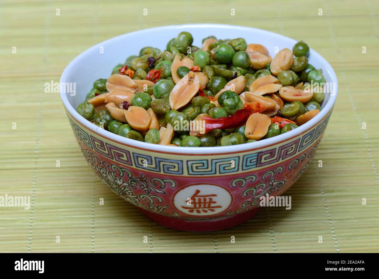 Asian snacks in shell, peanuts, green peas, chili Stock Photo - Alamy