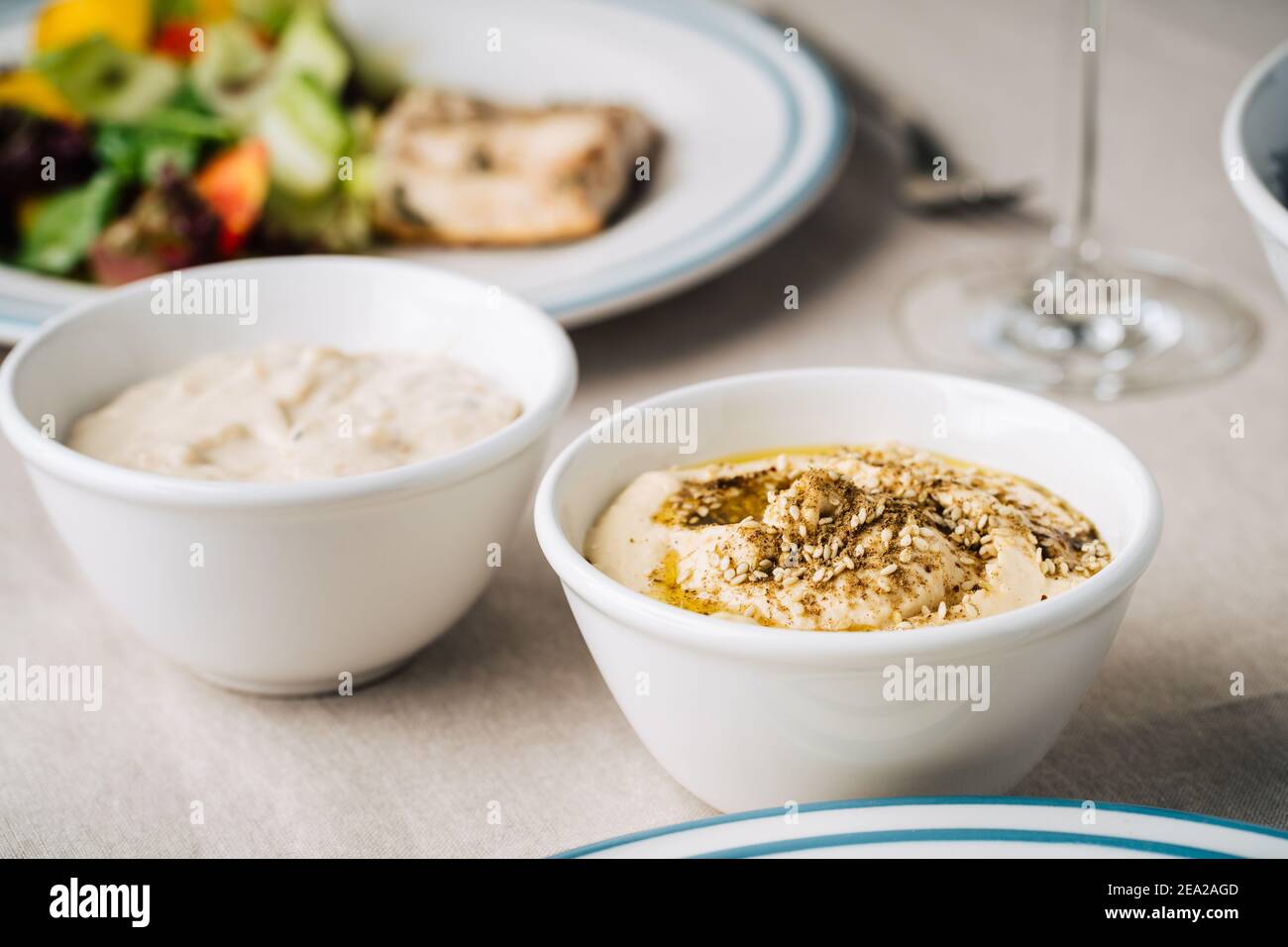Hummus and baba ghanoush on the kitchen table. Close up. Eastern Dish Stock Photo