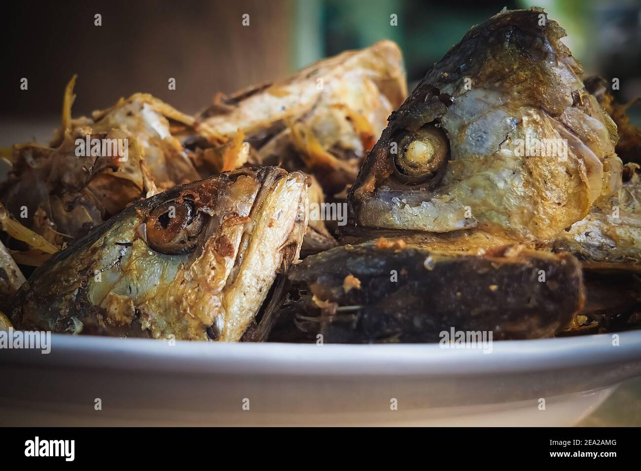 Fried Fish Heads For A Simple Meal Of Rural People In Thailand Stock Photo Alamy