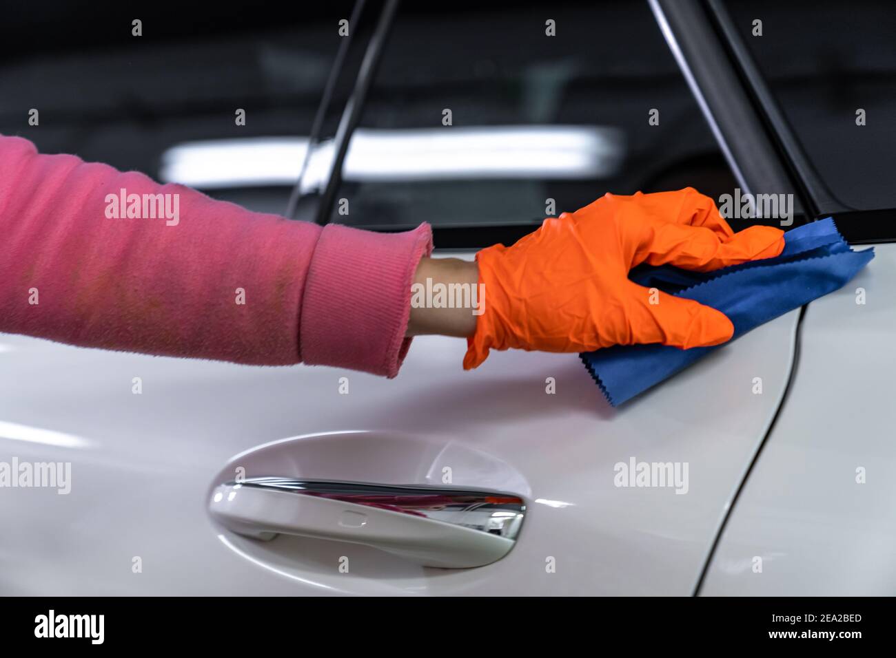 manual application of ceramic protection on the car body Stock Photo