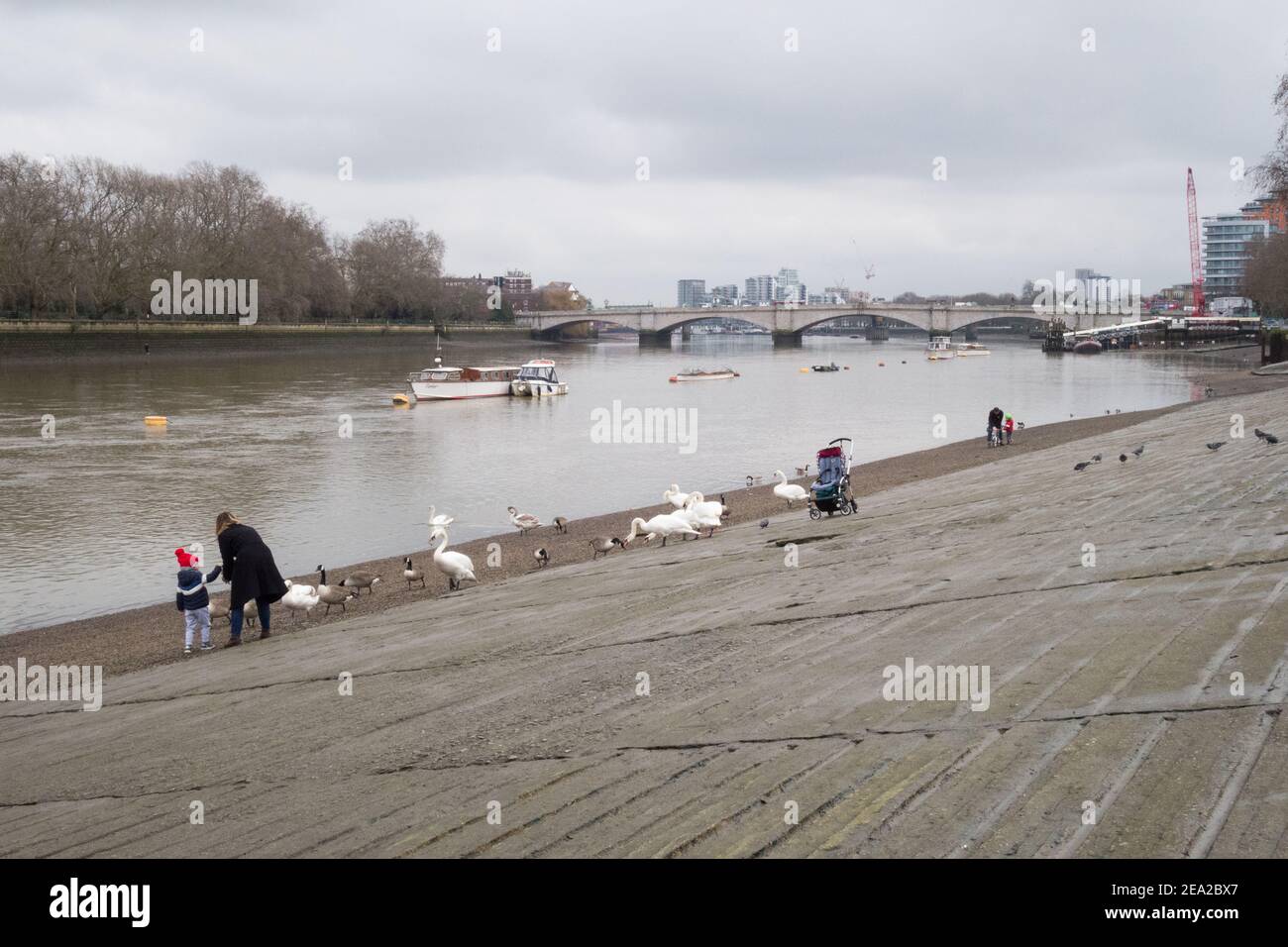 A mother and child on Putney slipway next to the River Thames in London, U.K. Stock Photo