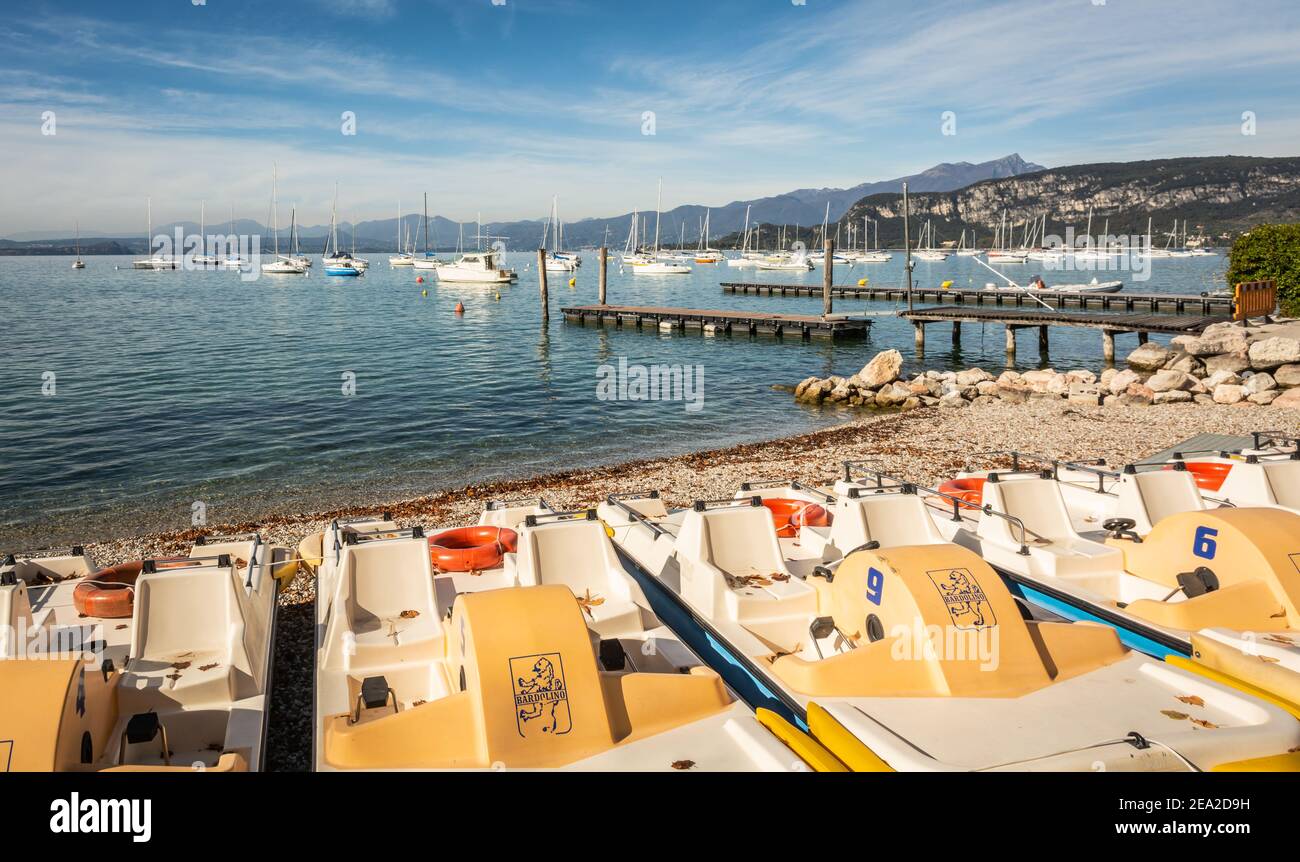 Bardolin on Garda lake in northern Italy. Boats in the old harbour. Bardolino, Verona province, Italy - october 29, 2020 Stock Photo