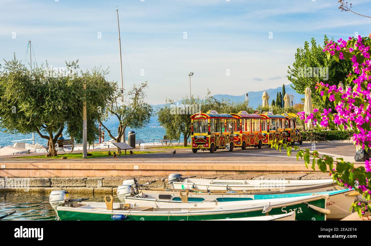 the small Train of the City of Bardolno. This colorful little train takes tourists on a sightseeing tour around Bardolino, one of the attractive local Stock Photo