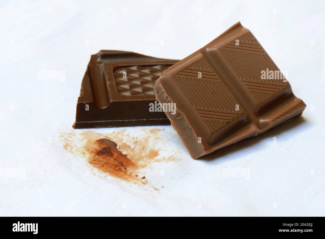 Chocolate stain on fabric, chocolate stain, chocolate pieces Stock Photo