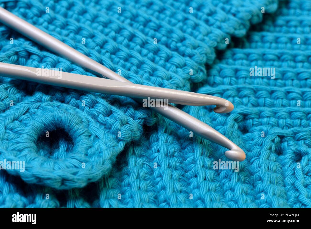 Crochet hooks with potholders Stock Photo