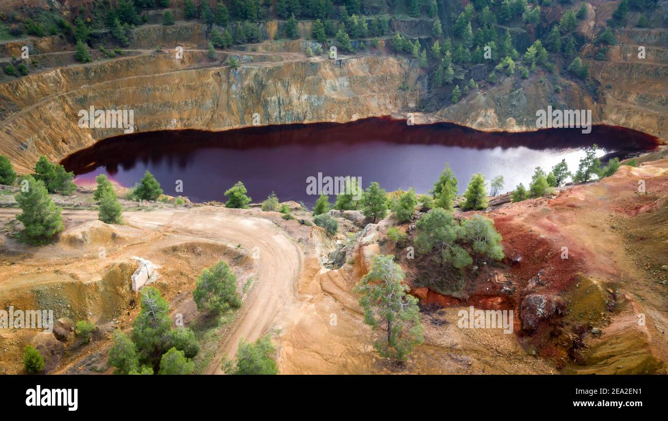 Mitsero red lake (Cyprus). Toxic chemicals Kokkinopezoula sulfide open pit mine gave it an unnatural red and yellow hue Stock Photo - Alamy