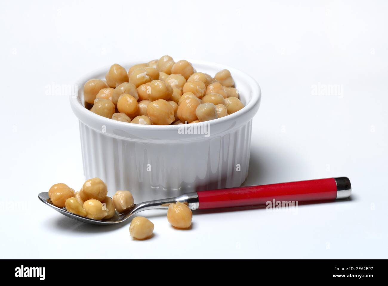 Chickpeas ( Cicer arietinum) in bowl and spoon Stock Photo