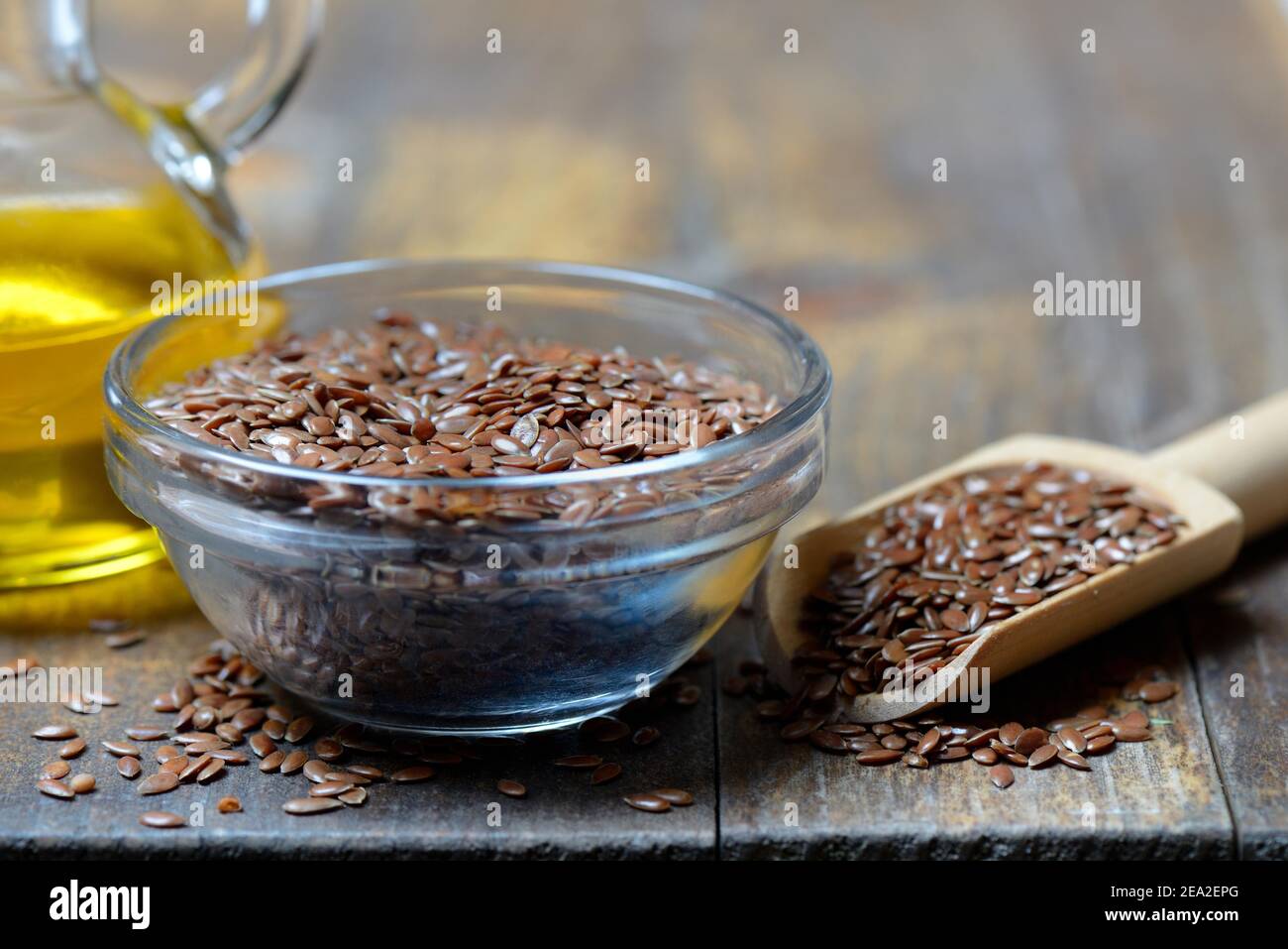 Linseed ( Linum usitatissimum) in husk and shovel and linseed oil Stock Photo Alamy