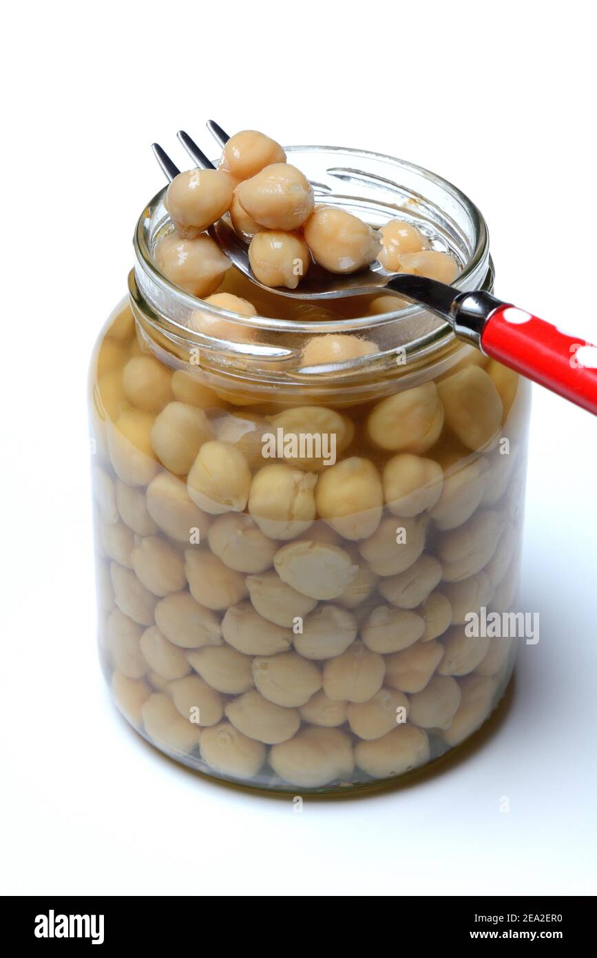 Chickpeas ( Cicer arietinum) in glass with fork Stock Photo
