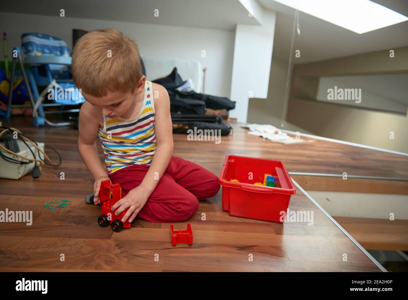 Little boy child playing with creative toys Stock Photo - Alamy