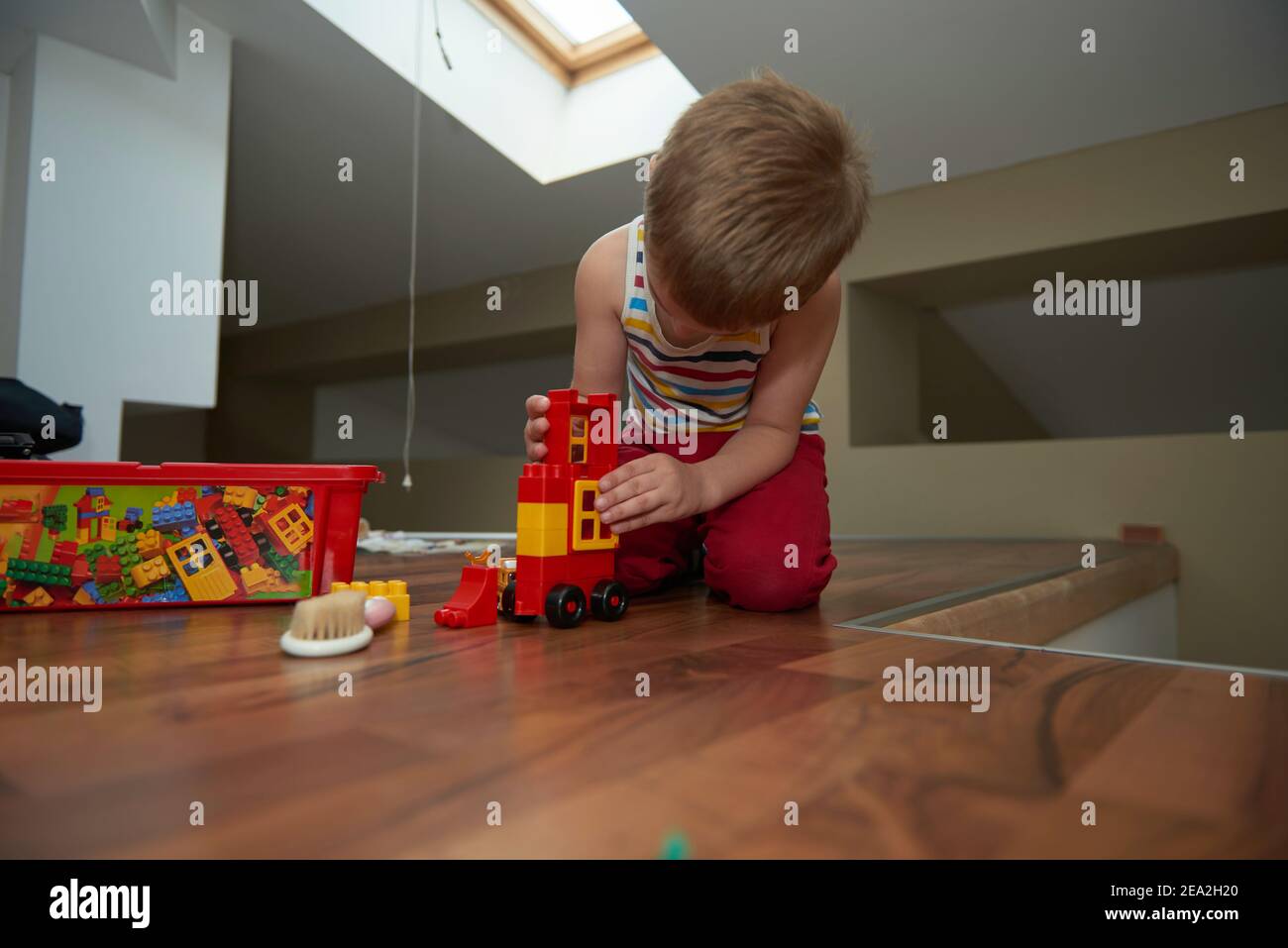 Little boy child playing with creative toys Stock Photo - Alamy