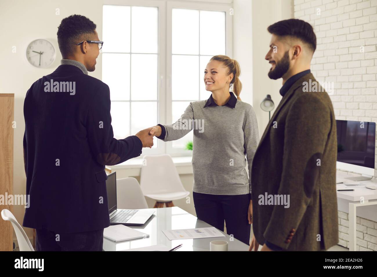 Woman shaking hands with advisor or job candidate after successful meeting or interview Stock Photo