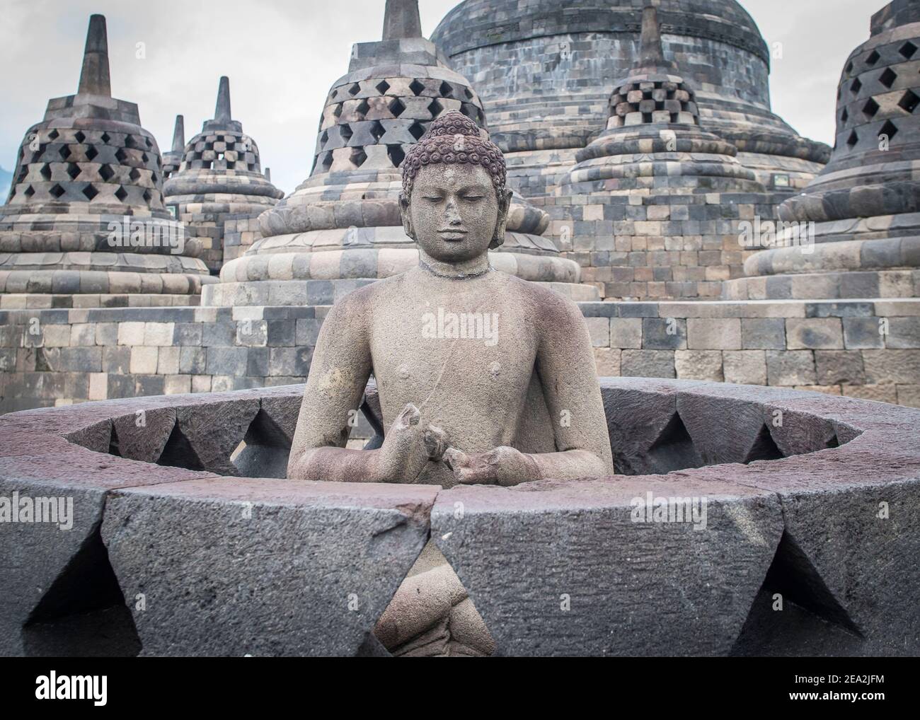 Buddhist sculpture on the top of Buddhist Temple, Borobudur, Jogyakarta in Java. Stock Photo