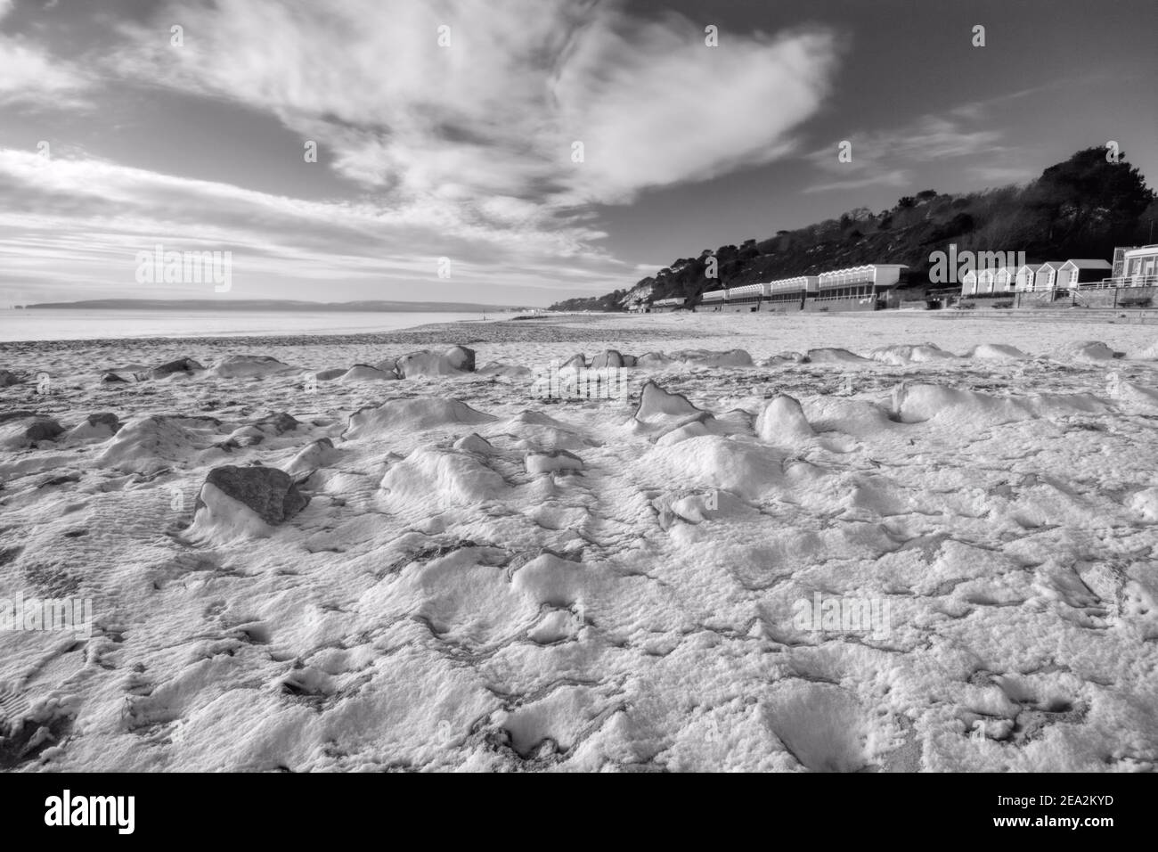 Scribbles - A sprinkling of snow on sand - Poole, Dorset Stock Photo