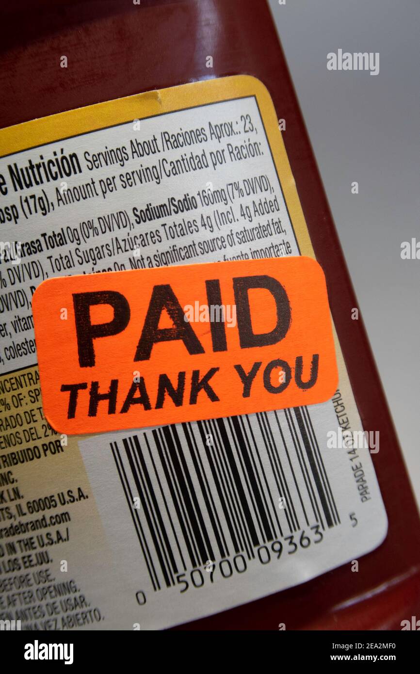'Paid, Thank You' Sticker on a Plastic  Ketchup Bottle, USA Stock Photo
