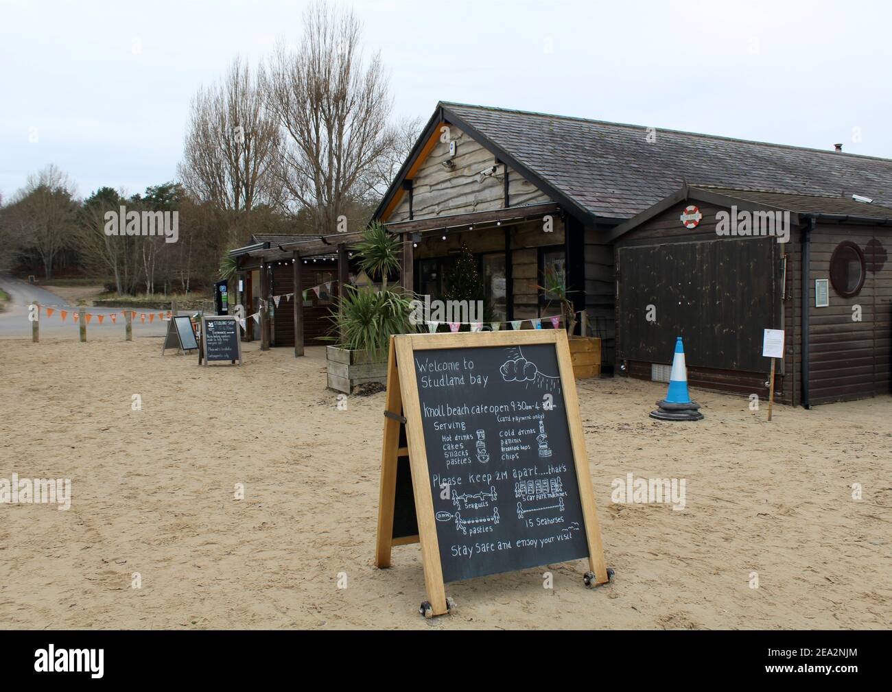 Knoll Beach Cafe in Studland, Dorset with information sandwich board in the foreground. Stock Photo