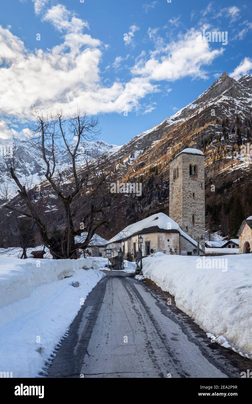 View of the old church of Staffa, Santa Maria Assunta, in winter. Macugnaga, Anzasca Valley, Verbano Cusio Ossola province, Piedmont, Italy. Stock Photo